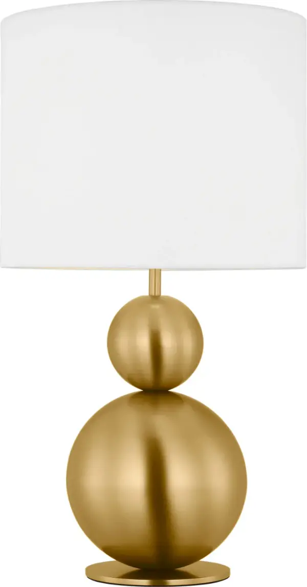 The Suki Medium Table Lamp by kate spade new york transforms minimalist design with its elegant stacked geometric forms and burnished brass finish. The white linen drum shade softly diffuses light while sculptural metal shapes create visual interest.
