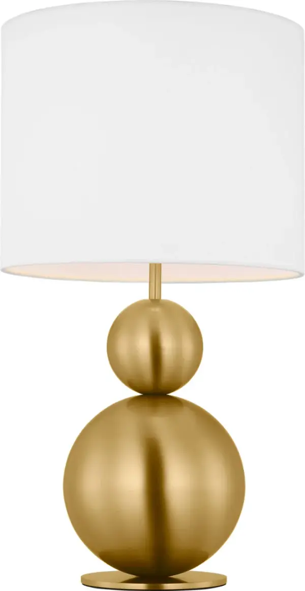 The Suki Medium Table Lamp by kate spade new york transforms minimalist design with its elegant stacked geometric forms and burnished brass finish. The white linen drum shade softly diffuses light while sculptural metal shapes create visual interest. - alternate view