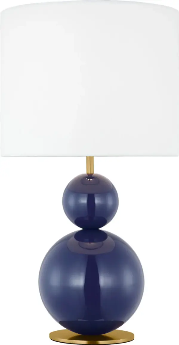 The Suki Medium Table Lamp by kate spade new york transforms minimalism into art with its stacked geometric metal forms and striking navy finish. The white linen drum shade softens light beautifully while clean lines create timeless sophistication.