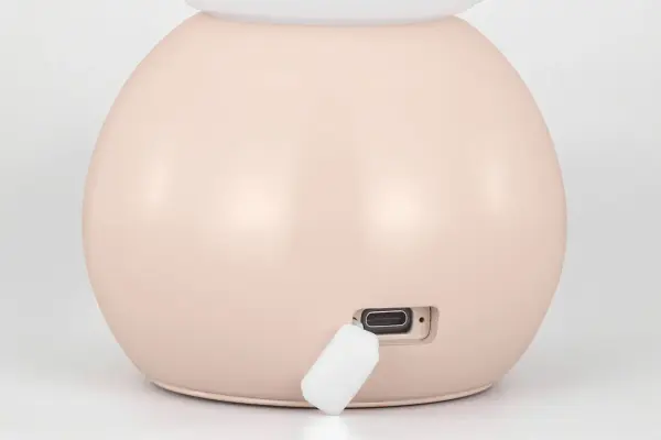 The Suki combines minimalist design with modern convenience. Its milk glass globe and sculptural blush base deliver soft, warm lighting while USB-C charging eliminates cord clutter. Perfect for contemporary and preppy spaces. - alternate view