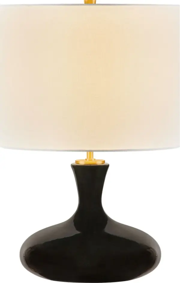 The Amber 21" table lamp combines a sophisticated black ceramic base with clean contemporary lines. Its medium scale makes it versatile for bedrooms, living spaces, and offices while the neutral finish complements diverse décor styles.