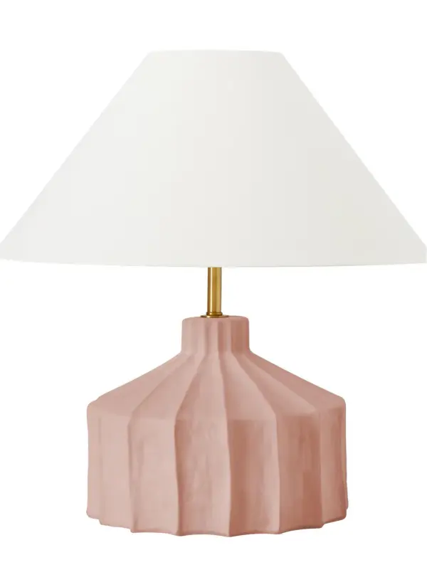 The Veneto table lamp combines authentic concrete construction with a soft linen shade, creating a sophisticated balance of industrial materiality and refined elegance. Its uneven texture and sculptural form make it a statement piece.