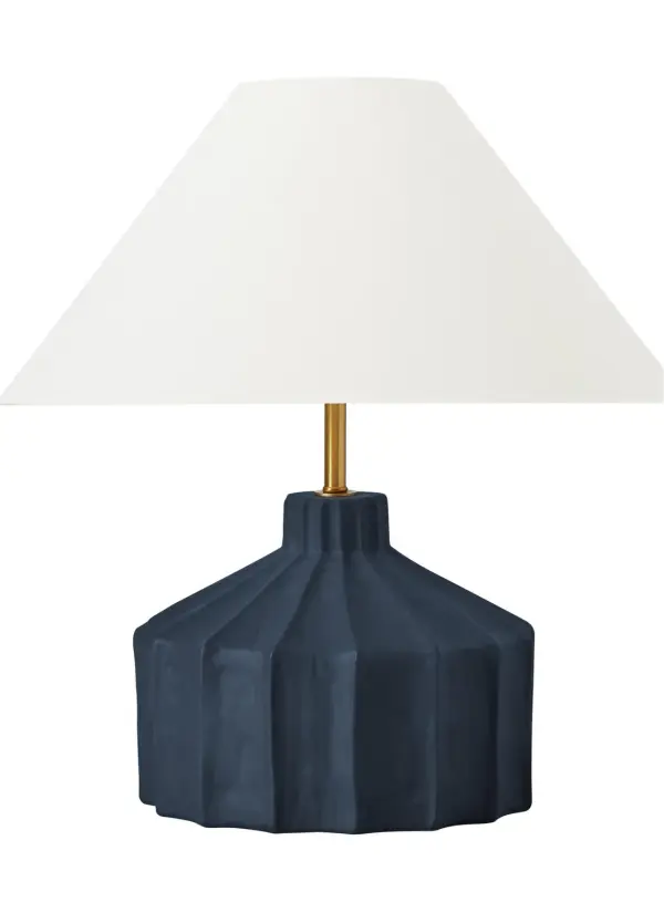 Kelly Wearstler's Veneto table lamp transforms authentic concrete-inspired ceramic into a sculptural lighting statement. The hand-applied matte blue wash finish creates unique textural variations, while the white linen shade softens the light for ambient warmth.