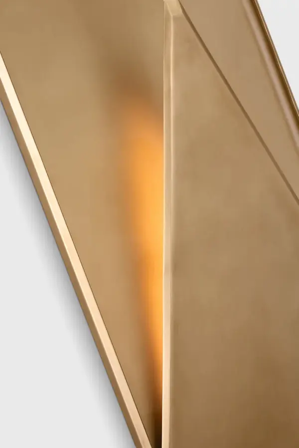 The Punto 38 Wall Sconce combines contemporary design with hand-rubbed antique brass finish, creating a statement piece for outdoor spaces. Its substantial 38-inch scale makes it ideal for larger architectural features. - alternate view