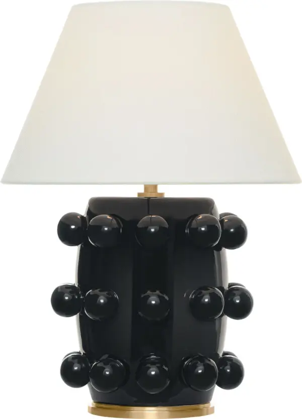 The Linden cordless table lamp combines modern convenience with timeless design. Its portable, battery-powered operation eliminates cord clutter while the classic black finish and linen shade complement any décor.