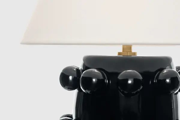 The Linden cordless table lamp combines modern convenience with timeless design. Its portable, battery-powered operation eliminates cord clutter while the classic black finish and linen shade complement any décor. - alternate view