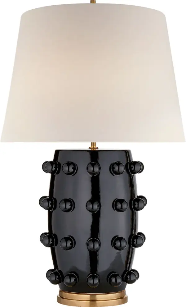 The Linden Medium Cordless Table Lamp combines sophisticated black finish with practical wireless functionality. Perfect for spaces without nearby outlets or creating flexible lighting arrangements.
