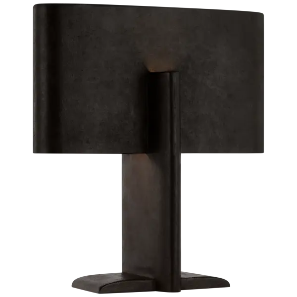 The Lotura table lamp features a striking intersecting geometric form in Museum Black finish. At 17" tall, it delivers architectural interest and ambient lighting perfect for contemporary interiors.