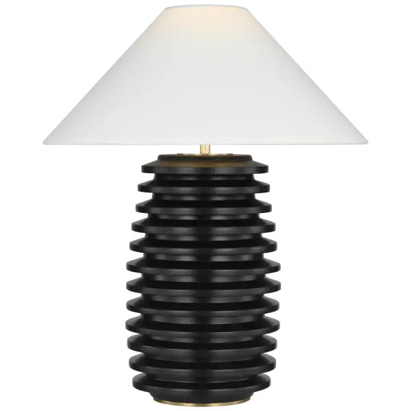 The Crenelle table lamp showcases architectural stacked wood construction in rich ebonized birch, creating visual interest through geometric layering. The natural linen shade softens the dramatic dark finish, making it versatile for both traditional and contemporary interiors. - alternate view