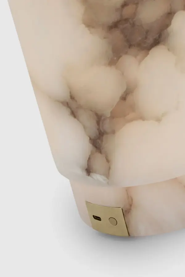 The Tourne combines the timeless beauty of alabaster with modern rechargeable technology. At 12" tall, this portable lamp offers warm ambient lighting without cords, perfect for flexible placement throughout your home. - alternate view