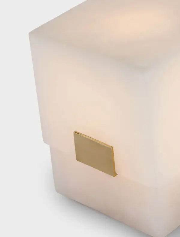 The Covet rechargeable accent lamp combines natural alabaster with antique-burnished brass for a sophisticated portable lighting solution. Its compact 6-inch size and cordless design offer versatile placement options throughout the home. - alternate view