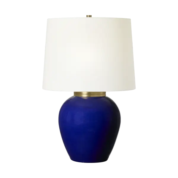 The Lilian Medium Table Lamp features stunning crystal construction with a distinctive cobalt blue finish, bringing sophisticated color and light-refracting beauty to any space. Perfect for adding a jewel-toned accent.