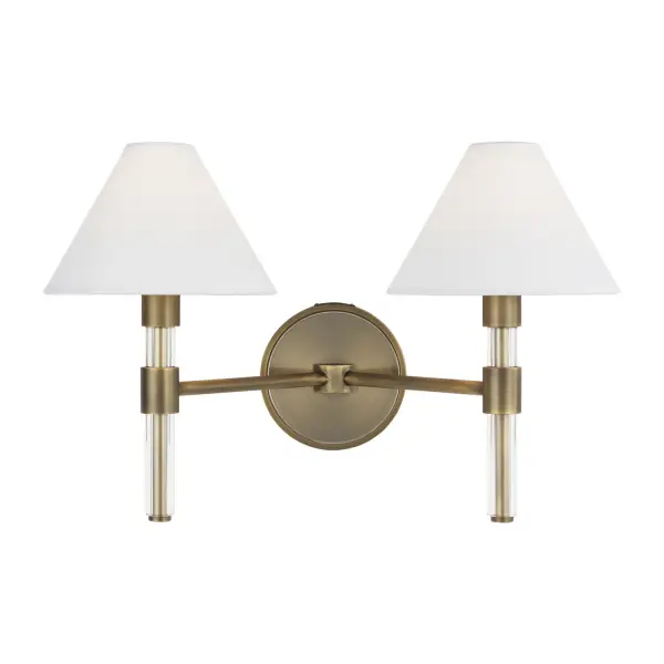 The Robert vanity fixture combines clean modern lines with warm brass tones, featuring distinctive Lucite stems and soft paper shades. Designed by Lauren Ralph Lauren, it brings sophisticated style to bathrooms and powder rooms.