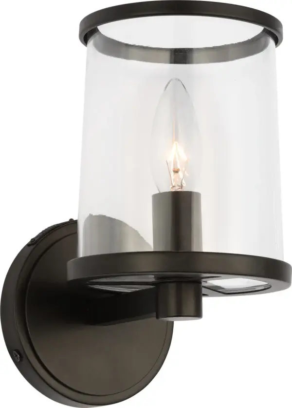 The Reynolds Small Vanity combines industrial character with refined simplicity. Its clear glass shade and sleek metal ring create sophisticated contrast, while the candelabra-style bulb adds vintage charm. Damp-rated for bathroom use. - alternate view