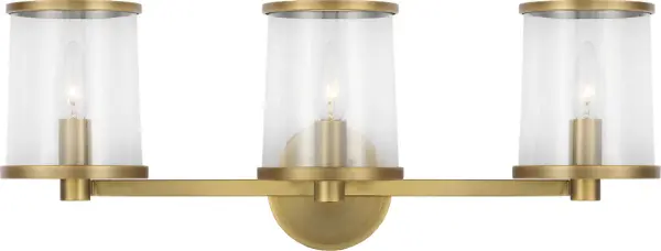 The Reynolds Large Vanity combines classic candelabra styling with contemporary refinement. Clear glass shades and time worn brass finish create sophisticated illumination perfect for bathrooms and hallways. Damp-rated for moisture-prone areas. - alternate view
