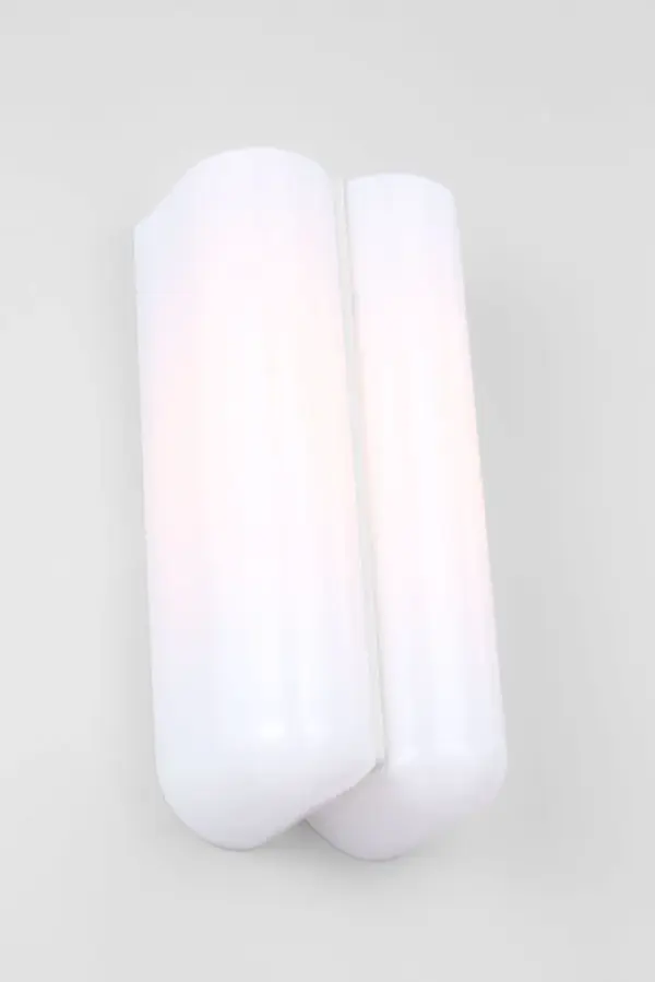 The Cheverny Small Sconce combines clean minimalist design with functional elegance. Two rounded milk glass shades provide soft, diffused light while the central metal strip adds architectural interest. Damp-rated for bathroom use. - alternate view
