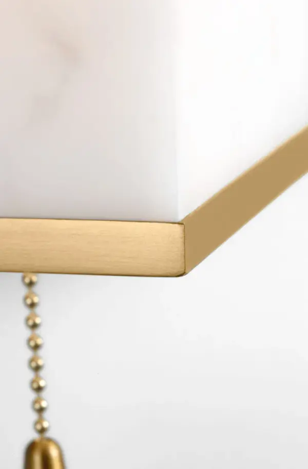The Cleor 8 Sconce delivers 1930s Parisian glamour with modern sustainability. Its faux alabaster shade creates warm ambient light while burnished brass framing adds architectural sophistication to intimate spaces. - alternate view
