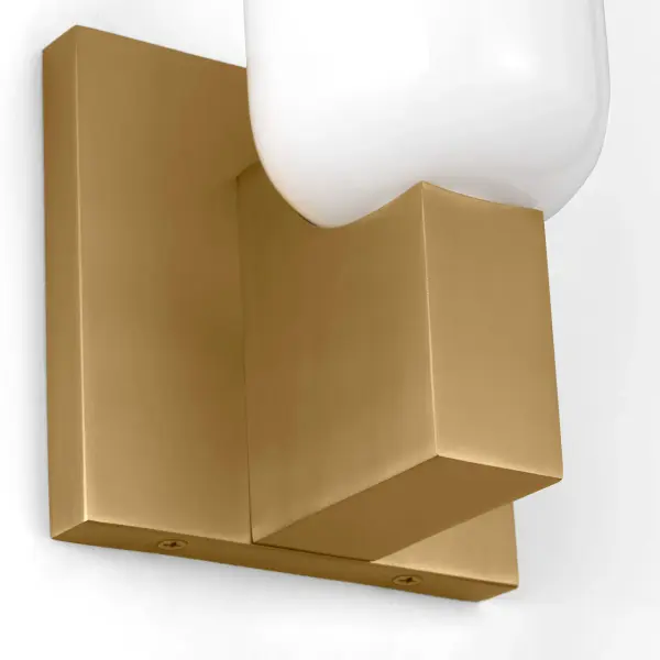 The Maroux 12" Sconce channels 1930s French design with its geometric precision and opaline glass cylinder. Hand-finished burnished brass creates subtle patina variation, making each piece unique. Perfect for hallways or paired installations. - alternate view