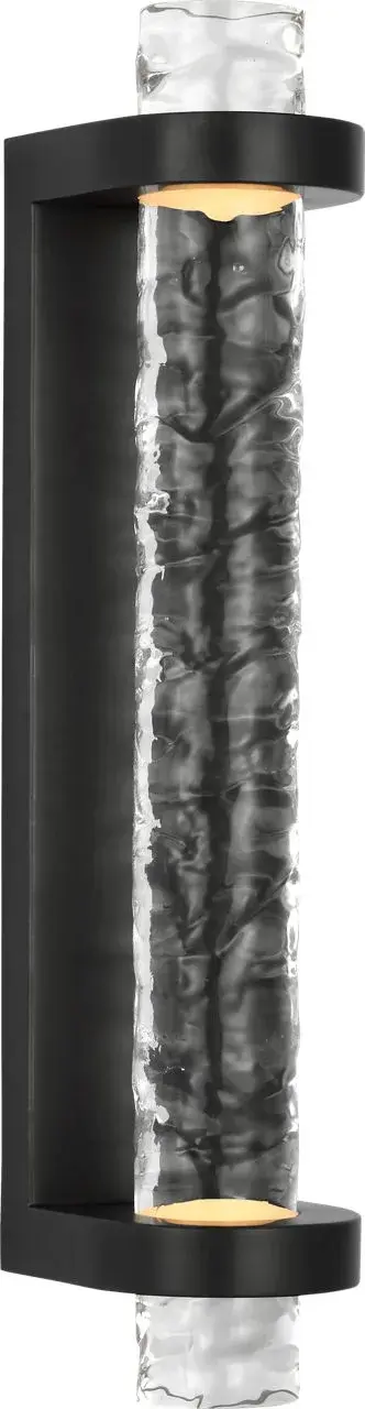 The Theron 15" Linear Bath Sconce combines classic bronze finish with unique clear wavy glass for sophisticated bathroom lighting. Its linear design provides even illumination ideal for vanity areas.