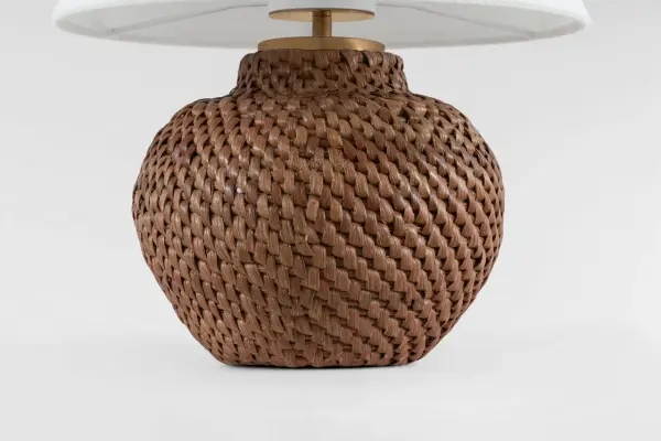 The Avedon brings natural rattan warmth and cordless flexibility to any space. Its compact 11" size and linen shade create soft, ambient lighting perfect for intimate settings both indoors and out. - alternate view