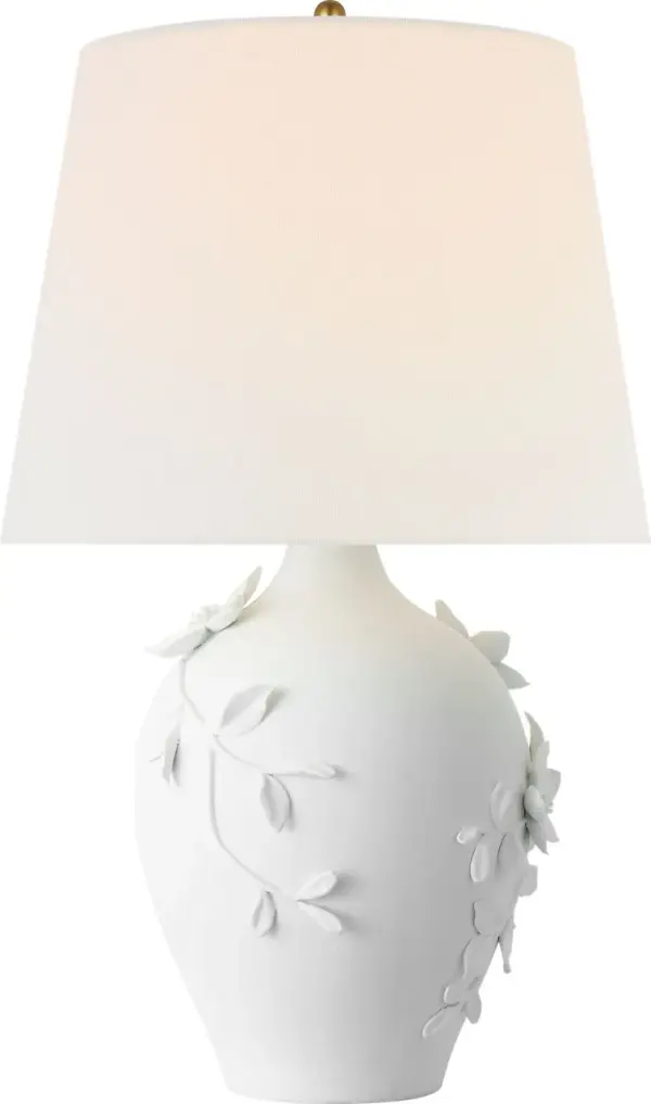 The Elowen table lamp combines sculptural plaster white ceramic with a soft linen shade, creating a sophisticated lighting solution that bridges traditional and contemporary design. At 28" tall, it provides substantial presence while maintaining versatility across residential and hospitality settings.