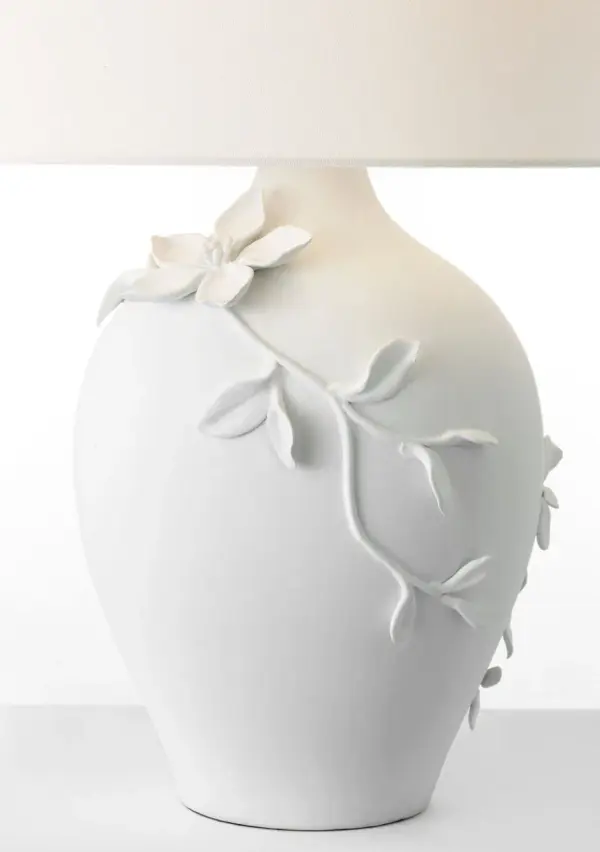 The Elowen table lamp combines sculptural plaster white ceramic with a soft linen shade, creating a sophisticated lighting solution that bridges traditional and contemporary design. At 28" tall, it provides substantial presence while maintaining versatility across residential and hospitality settings. - alternate view