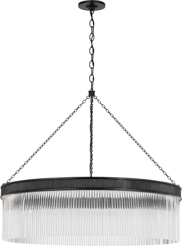 The Menil chandelier combines architectural bronze framework with cascading crystal rods for a sophisticated statement piece. At 40 inches, it's perfectly scaled for larger dining tables and kitchen islands.