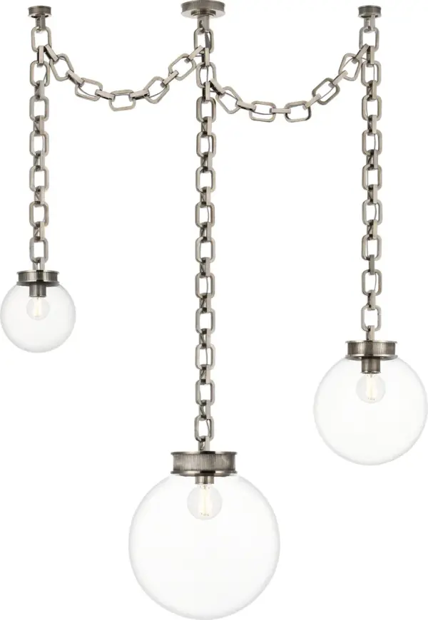 The Bellamy chandelier makes a bold architectural statement with three clear glass globes suspended on a pewter chain framework. Its transitional design bridges traditional and contemporary aesthetics, perfect for elevated dining spaces.