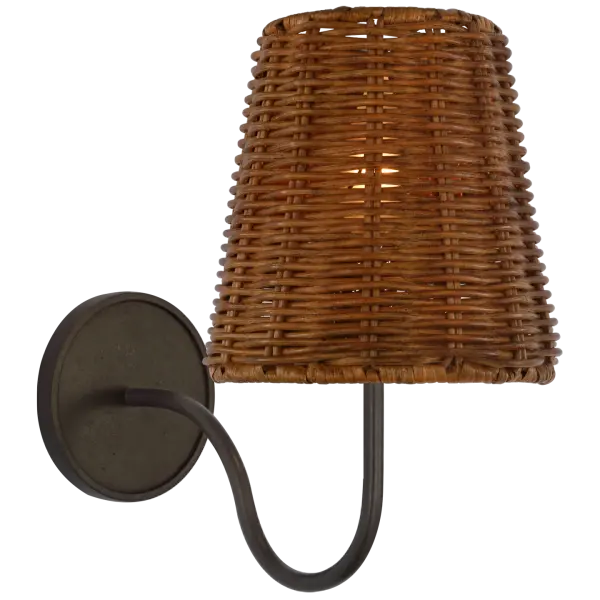 The Lyndsie Small Sconce blends aged iron hardware with a handwoven dark wicker shade for organic texture and warm ambient lighting. Perfect for intimate spaces seeking natural materials and relaxed sophistication.