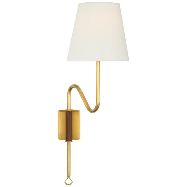 The Griffin Articulating Sconce combines hand-rubbed antique brass with luxurious saddle leather accents and a soft linen shade. Its adjustable arm provides functional task lighting while adding sophisticated style to any space.