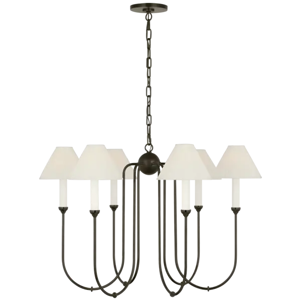The Ingela chandelier combines traditional multi-arm design with a contemporary Modern Iron finish and sophisticated silk pleat shades. At 36 inches wide, it makes a substantial statement while maintaining refined elegance.
