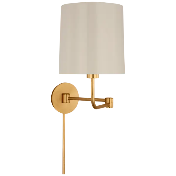 The Go Lightly swing arm wall light combines classic elegance with practical adjustability. Its gild finish and china white shade create a sophisticated look perfect for reading nooks and bedside lighting.