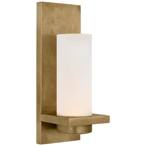 The Cornado Hurricane Sconce combines traditional elegance with modern durability. Its Museum Brass finish and etched crystal shade create sophisticated ambiance both indoors and out, perfect for coastal or transitional spaces.
