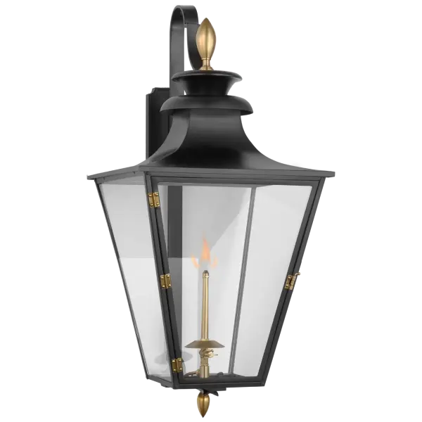 The Albermarle Medium Wall Lantern combines timeless gas lantern design with a striking matte black and brass finish. Clear glass panels showcase the flame while the bracketed mounting adds architectural interest. - alternate view