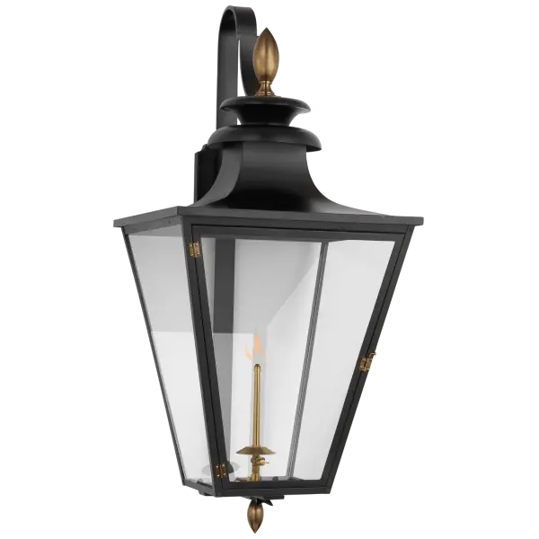 The Albermarle Large Bracketed Gas Wall Lantern combines traditional craftsmanship with modern durability. Its matte black and brass finish creates sophisticated contrast, while clear glass panels showcase the authentic gas flame. - alternate view