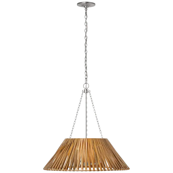 The Corinne pendant beautifully blends polished nickel hardware with natural wicker wrapping, creating a sophisticated coastal aesthetic. At 24 inches, it provides substantial presence while maintaining versatility across dining and living spaces.