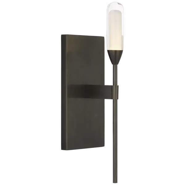 The Overture Medium Sconce combines classic bronze metalwork with clear glass for versatile lighting. Its transitional design bridges traditional and contemporary styles, making it suitable for various interior settings.