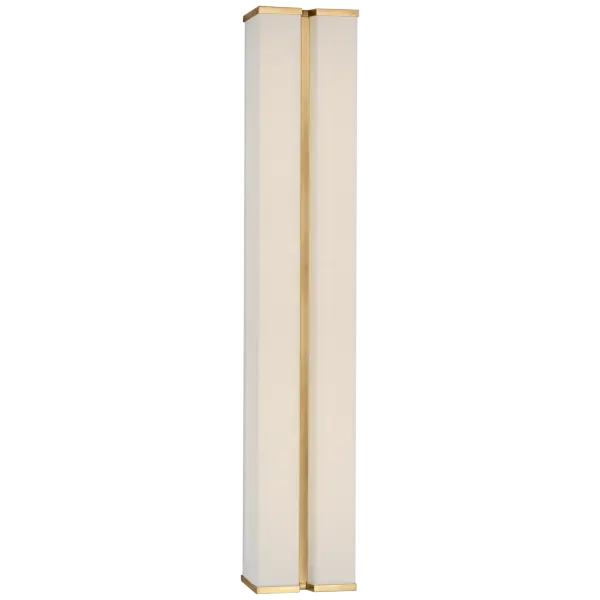 The Vernet 30" sconce combines hand-rubbed antique brass with soft linen shading to create a sophisticated linear wall fixture. Its substantial 30-inch length makes a bold statement while providing ample illumination.