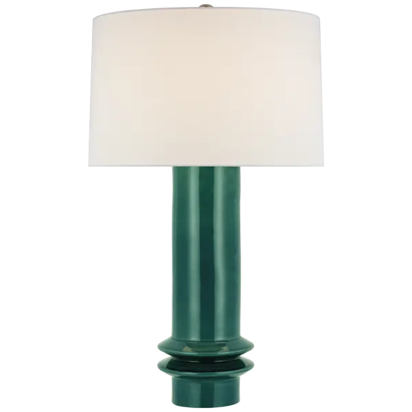 The Montaigne Medium Table Lamp features a stunning emerald crackle ceramic base paired with a classic linen shade. Its distinctive glazed finish and medium scale make it versatile for bedrooms, living spaces, and offices.