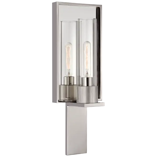 The Beza Single Reflector Sconce combines polished nickel with mirrored accents and clear glass for a sophisticated, light-enhancing design. Perfect for bathrooms and hallways where reflective surfaces amplify illumination.