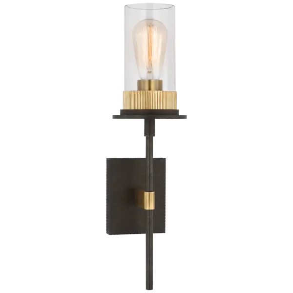The Beza Medium Tail Sconce combines warm iron and antique brass finishes with clear glass for a sophisticated transitional look. Its distinctive tail design adds architectural interest to any wall.