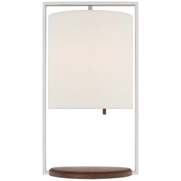 The Zenz Medium Table Lamp combines polished nickel with rich walnut wood for a refined transitional aesthetic. The linen shade provides soft, diffused light perfect for bedside or desk use.