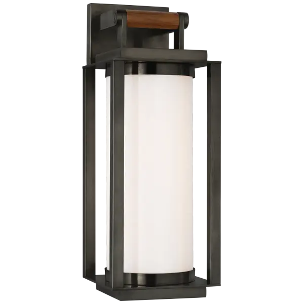 The Northport Medium Wall Lantern combines nautical charm with sophisticated materials. Bronze metalwork paired with warm teak accents creates an inviting outdoor presence, while white glass diffuses light beautifully for welcoming entryways and patios.