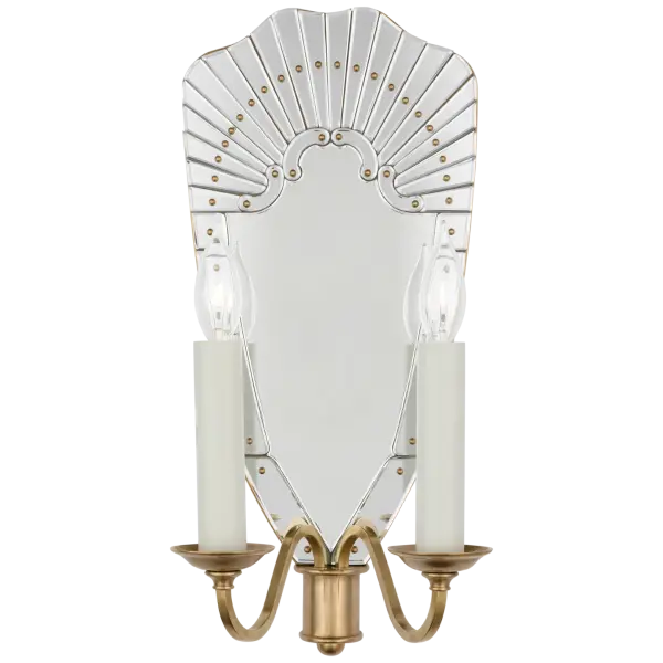 The Adelaide Large Double Sconce combines reflective mirror glass with natural brass for a sophisticated lighting solution. Its double-arm design provides ample illumination while the mirrored elements add depth and glamour to any space.