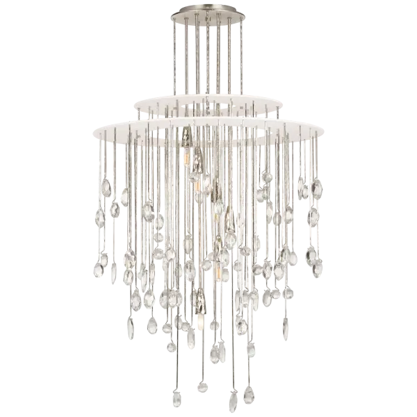 The Hailee Medium Chandelier combines polished nickel with plaster white in a sculptural design enhanced by crystal details. Its transitional aesthetic bridges traditional elegance and contemporary sophistication.