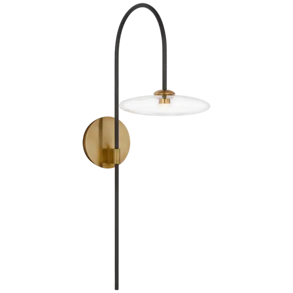 The Calvino Arched Sconce combines aged iron and hand-rubbed antique brass in a graceful arched design. Clear glass shades provide clean illumination while the mixed metal finish adds depth and visual interest to any space.