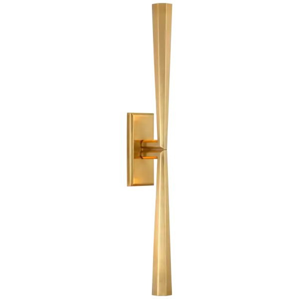 Eye-catching sleek metal lines define the Galahad by Thomas O'Brien. The minimalist aesthetic is at once modern and timeless, spanning sconces, chandeliers, and lanterns. Crafted from solid sculpted and welded brass, the refined fixtures will add a soft glow to rooms.