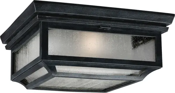 The Shepherd Flush Mount brings farmhouse charm to outdoor spaces with its dark weathered zinc finish. Perfect for covered porches and entryways, this fixture combines durability with rustic style.