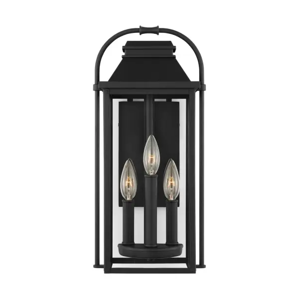 The Wellsworth outdoor wall sconce by Sean Lavin blends traditional design with subtle nautical influences. Cast aluminum construction ensures durability, while the textured black finish and clear glass create timeless curb appeal.