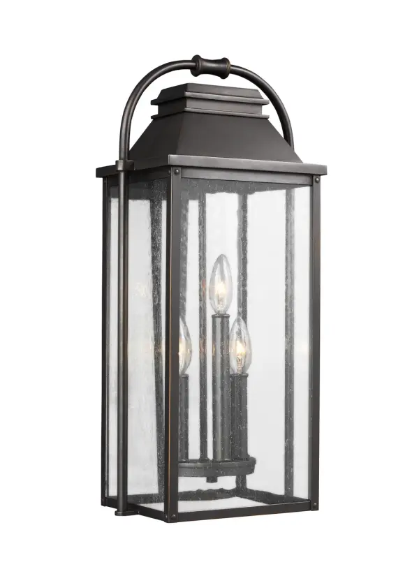 The Wellsworth outdoor lantern by Sean Lavin blends traditional design with subtle nautical influences. Cast aluminum construction and Wet Rating ensure long-lasting durability in any weather. Clear seeded glass adds vintage character.